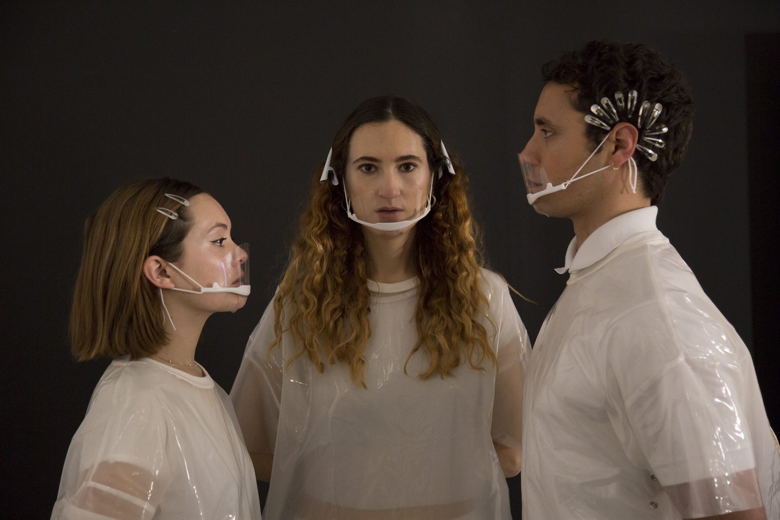 No Fall Games: three performers in white with transparent face visors
